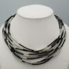 Zwarte leren ketting Stella met buisjes