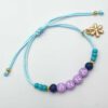 Ibiza armband met naam aqua met bloem