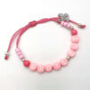 Ibiza armband met naam roze met bijtje zus