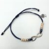 Infinty armbandje zwart met beige met droomboom