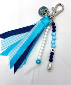 Blauw witte sleutelhanger met uiltje met lintjes en eigen naam